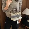 Bolso de mano rayado con bloques de color único para mujer, nueva moda otoñal de tendencia 2026, adecuado para el trabajo y los desplazamientos, bolso de hombro y cruzado