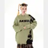 Suéter de Punto Patchwork con Parche de Letras Desgastado Estilo Retro Americano, Unisex de Alta Gama Holgado Versátil de Punto Moderno