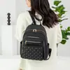 Mochila de moda acolchada con costuras y remaches de color sólido transfronteriza para mujer, resistente al agua, estilo coreano, gran capacidad, mochila simple para mujer