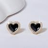 Pendientes de estrella de cinco puntas con aguja de plata esterlina s925 para mujer, elegantes pendientes negros con lazo y corazón, nuevos pendientes coreanos sencillos.