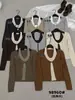 VI+ Único 2026 Outono Estilo Coreano Minimalista Versátil Color-blocking Falso Duas Peças Gola Halter Manga Longa Suéter de Tricô 98960