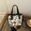 Bolso de Moda Estilo Chino con Gran Capacidad, Nuevo Versátil Lona para Viajes Diarios Bolso de Hombro Tote para Mujer Primavera y Verano 2026
