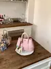 Bolso de Mano de Diseño de Moda de Nicho para Mujer 2026 Nuevo Estilo Coreano Bolso Cubo para Viajes Diarios Bolso de Hombro Único Cruzado Transfronterizo