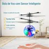 Aeronave elétrica com sensor humano, grande sucesso de vendas internacionais, bola de cristal colorida, helicóptero suspenso, brinquedo infantil com luzes.