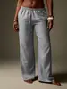 Calça casual popular europeia e americana transfronteiriça com textura plissada para mulheres, com cós de cordão, design de bolso, corte solto e design de perna larga fluido