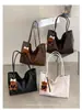 Bolso de Hombro Único Versátil de Gran Capacidad para Mujer 2026 Nuevo de Gama Alta Bolso Tote de Mano Casual para el Trabajo Transfronterizo