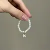 Mini Labubu Cuarta Generación Caja Sorpresa Ropa de Muñeca Collar Colgante Labubu 26 Letras Collar de Perlas Accesorios de Joyería