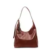 Bolsa Tote Casual de Couro Macio Estilo Japonês e Coreano para Mulheres Verão 2025 Versátil para Trabalho e Dia a Dia Bolsa de Ombro Transversal