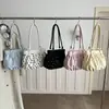 Bolso de mano fresco y delicado de lunares con un lazo, nuevo diseño de moda nicho para mujer 2026, bolso de hombro para ir al trabajo, bolso de axila