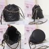 Bolso bombonera de piel genuina, bolso pequeño estilo Chanel con cadena de bolas doradas, cadena de cintura rómbica para mujer de alta gama, nuevo bolso bandolera de piel de vaca 9906