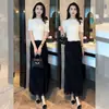 Conjunto de saia e top de malha feminino estiloso 2026 verão novo top curto de tricô com saia de franja conjunto de duas peças moderno