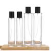 Venta al por mayor en stock, botella de perfume de bayoneta, embalaje de cosméticos, botella de vidrio vacía cilíndrica para aromaterapia, botella con atomizador de 100 ml
