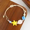 Jingdezhen Navidad Pulsera de Cuerda Trenzada de Cerámica Pulsera de Trébol de Cuatro Hojas Joyería Artística Hecha a Mano Venta al por Mayor Pulseras de Cerámica para Atracciones Turísticas