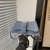 Bolso de diseño único para mujer, nueva colección 2026, bolso cruzado con cadena de patrón de piedra, bolso de hombro moderno y a la moda, bolso de axila, bolso baguette
