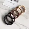 Elástico de Cabelo Espesso e Elástico para Adultos na Cor Café para Rabo de Cavalo, Corda de Cabelo com Alta Elasticidade, Faixa de Cabelo Simples Fashion Ondulada Venda por Atacado