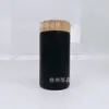Elegante Botella de Vidrio Negra Pintada en Spray con un Diámetro de 57 mm, en Stock, con Tapa de Bambú, Disponible en Varias Capacidades, Botella Cápsula, Botella de Aceite de Sésamo
