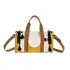 Nova Bolsa de Mão Color Block de Grande Capacidade Feminina Bolsa Cilíndrica Versátil Casual Transversal de Tecido Bolsa Transversal de Viagem com Múltiplos Bolsos