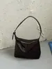 Bolso de hombro tejido casual de nicho para mujer, nuevo de verano 2026 versión coreana, bolso cruzado simple versátil tipo bollo ins