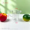 Taza medidora de plástico con tapa y escala en stock, especializada para tiendas de té de burbujas, jarra medidora doméstica de grado alimenticio, resistente a altas temperaturas