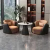 Conjunto minimalista y lujoso de sofá individual y mesa de centro, adecuado para uso casual en hoteles, salones de belleza, áreas de recepción y centros de exposiciones; también incluye un juego de mesas y sillas para reuniones y discusiones