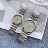Transmisión en vivo de Tiktok reloj de pareja de acero al cuarzo con banda de berenjena europea tendencia de moda para parejas