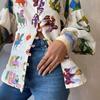 Europa y Estados Unidos transfronterizo nueva estación independiente AliExpress moda personalidad estampado graffiti solapa manga linterna cárdigan camisa