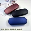 Estuche de Cuero Color Sólido para Gafas Caja de Hierro Anti-Presión Estudiante Miopía Gafas Gafas de Lectura Caja de Almacenamiento Óptico Universal Venta al por Mayor