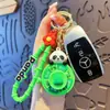 Llavero Creativo de Panda de la Suerte Coche Giratorio Lindo Dibujo Animado Celebridad de Internet Colgante para Bolso Regalo Pequeño Venta al por Mayor