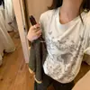 2026 Novo Design de Verão Camiseta de Manga Curta com Estampa de Leão para Mulheres, Estilo Curto, Top Retrô Americano Doce e Picante