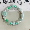 Fabricantes suministro pulsera de cachorros de cerámica diseño de nicho pulsera nuevo chino lindo cachorros huesos cuentas juguetonas