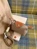 Mini Bolsa de Nylon para Empanadas 2026 Nuevo Modelo Bolsa para Audífonos Bloques de Color Compacta para Monedas y Llaves Bolso Cuadrado Pequeño de Moda