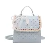 Mochila feminina de temperamento doce e fofo, estilo coreano, moderna e versátil, bolsa de ombro pequena elegante com renda de bolinhas para viagens e deslocamento