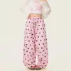 Pantalones anchos plisados con estampado de lunares dulces y geniales estilo americano para mujer, con un ambiente relajado y casual, versátiles y largos