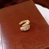 Pendientes de borla con flor de trébol de circonita vintage con un toque de alta gama, pendientes versátiles y de moda al por mayor