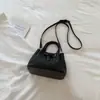 Bolso pequeño elegante y atractivo estilo coreano modelo nuevo 2026 bolso de mano de color liso bolso cruzado con patrón tejido bolso de mano exquisito