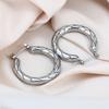 Europa y Estados Unidos arete de titanio y acero redondo hidráulico transfronterizo aretes de chapado de alta gama para mujer multiestilo en stock suministro directo de fábrica