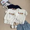 Camiseta de manga corta de color liso con estampado de casita estilo coreano, nuevo modelo primavera-verano 2026, cuello redondo, versátil, top juvenil y refrescante