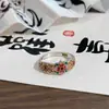 Nuevo Anillo Estilo Palacio Chino Esmalte Flor de Cuatro Hojas para Mujer Lujo Ligero Gama Alta Diseño de Nicho Anillo Ajustable