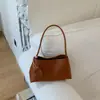 Bolso de mano retro estilo coreano transfronterizo, diseño de nicho, bolso de hombro versátil, bolso elegante para mujer para el antebrazo para ir al trabajo