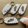 Superventas en EE. UU., Cuchillo retráctil de material ABS de plástico con llavero, Cuchillo de hoja retráctil, Navaja de bolsillo retráctil