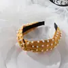 2022 Corea del Sur estilo celebridad de Internet Accesorios para el cabello europeos y americanos Perlas completamente abalorios torsión cruzada diadema simple anudada diadema