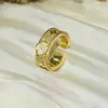 Anillo de Trébol de Cuatro Hojas de Lujo Ligero Transfronterizo Europeo y Americano Chapado en Cobre Dorado Circonita Microincrustada Moda Exquisita Anillo Abierto de Gama Alta para Mujeres