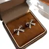 Pendientes Románticos de Té Dulce Café Oro y Plata Aguja Zirconia Súper Brillante Lazo para Mujer, Pendientes de Lujo Ligero Nicho de Gama Alta