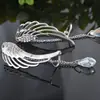 Comercio Exterior aretes de moda europeos y americanos alas de ángel taladro brillante clip para oreja cadena de cristal borla joya para oreja
