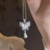 Collar con colgante de borla de seda con flor de mariposa Suzuki para mujer 2024, nuevo colgante elegante y exquisito de lujo chino ligero.