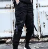 Marca de moda original INS macacão masculino com múltiplas bolsas primavera juventude punho na barra calça esportiva cropped calça hip-hop masculina estudante