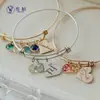 Europa y Estados Unidos pulsera retráctil de corazón de melocotón de amor de doce piedras de nacimiento transfronteriza inscription de nombre pulsera de acero inoxidable diy