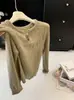 Nuevo Estilo Coreano Principios de Otoño Elegante Cuello Redondo Botón Único Hueco Manga Corta Diseño de Temperamento Femenino Prendas de Punto