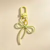 Hebilla de puerta de color macarrón con lazo y cinta, accesorios de joyería DIY hechos a mano con cuentas, llavero de dibujos animados