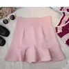 Falda corta casual de moda línea A para mujer cintura alta adelgazante petite talla extra pierna ancha cubriendo carne estilo callejero dulce persona moderna falda de longitud media